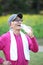 Senior Japanese man sweaty and thirsty after exercise drinks water outside