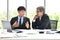 Senior and junior businessman discuss something during their meeting, Asian businessman, business concept