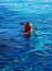 Senior kayaker on a kayak by the sea, active water sport and lei