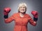 Senior lady in boxing gloves