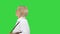 Senior lady carrying shopping bags on a Green Screen, Chroma Key.