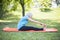 Senior lady enhancing body flexibility by stretching