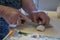 Senior lady making dumplings with stuffing