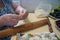 Senior lady making dumplings with stuffing