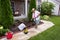 Senior lady preparing the garden for flowers