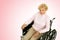 Senior Lady In Wheelchair Pink