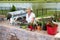 Senior lady working in her summer kitchen