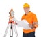 Senior land surveyor with theodolite