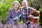 Senior laughing couple engaged in gardening