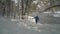 Senior make hiker is walking in a deep fresh snow