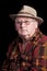 Senior male retired wearing glasses and hat