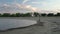 Senior male is riding a gravel bike on a beach