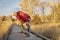 Senior male runner stretching on a trail