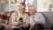 Senior male showing new smartphone elderly friend, using modern technology