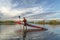 Senior male stand up paddler on a lake