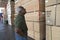 Senior Male Worker Counting Wooden Planks