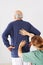 Senior man with back pain in physical therapy