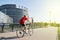 Senior man biking sportive Strasbourg, European Parliament build