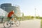 Senior man biking sportive Strasbourg, European Parliament build
