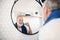 A senior man brushing teeth in bathroom indoors at home. Copy space.