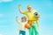 Senior man and child exercising on blue sky. Sports for kids. Sportsman grandfather and healthy kid with basketball ball