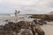 Senior man clicking photos with mobile phone at beach