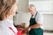 Senior man cooking in kitchen