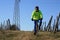 A senior man cyclist on vineyard hills