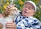 Senior man with dog in courtyard