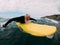Senior man doing surf with longboard riding a wave - Mature person having fun doing extreme sport - Joyful elderly concept - Focus