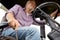 Senior man driving tractor at farm