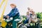 Senior man driving tractor trailer with his family