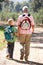 Senior man and grandson on country walk