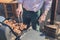 Senior man grilling meat on barbecue