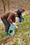 Senior man and her daughter picking nettle leaves