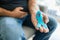 Senior man holding a blue cancer awareness ribbon