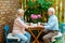 Senior man holding hands with happy retired wife