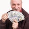 Senior man holding a stack of money. Portrait of an excited old businessman