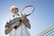 Senior Man Holding Tennis Racquet And Ball