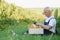 Senior man lifting box full of seasonal vegetables