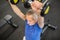 Senior man lifting weights on hammer strength machine