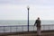 Senior man looking at sea in Eastbourne promenade in Sussex