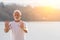 Senior man meditating, practicing tai chi chuan in nature