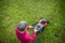 Senior man mowing his garden - shot from above