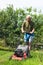 Senior man mowing lawn