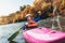 Senior man paddling kayak. Gray hair man enjoy river kayaking