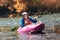 Senior man paddling kayak. Gray hair man enjoy river kayaking