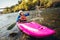 Senior man paddling kayak. Gray hair man enjoy river kayaking