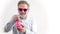 senior man in pink sunglasses holding the piggy bank - savings and happy retirement concept