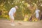 Senior man playing golf. Focus is on foreground.  Professional golfer